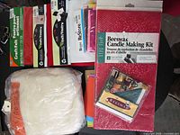 Overview of sealed beeswax candle kit, wool roving bag, felt packs