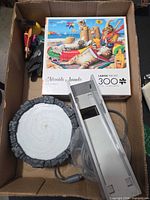 Puzzle box, dock with base, assorted toys inside shipping carton