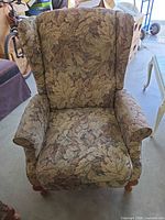 Front view of wingback recliner showing upholstery pattern and overall shape