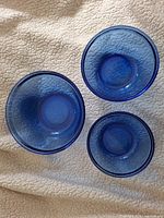 Top view of all three blue nesting bowls