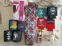 Full layout showing wine bottle carrier, boxed VinGo glass, koozies, bottle stoppers and novelty money sleeves
