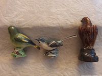 Front view of three Beswick bird figurines