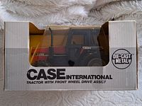 Front view of boxed 1/32 scale Case International tractor model