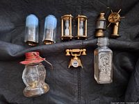 All nine miniature glass and brass items grouped on surface