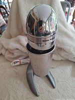 Mixer assembled with cup inserted, power cord visible