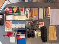 Overhead view showing all assorted office supplies laid out on table