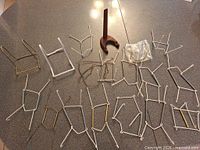 Overview of all plate hangers and bowl stands laid out on countertop