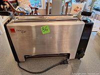 Front view of Ronco Ready Grill showing stainless steel front, controls and power cord