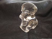 front view of clear glass dog candy container