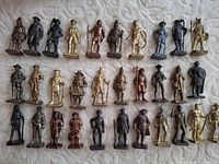 All 31 metal figurines arranged in grid