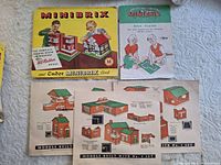 Box lid, Minibrix and Tudor Minibrix book, Base Plates leaflet, two model plan sheets displayed