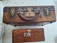 Top view of both boxes closed showing hardware and carving