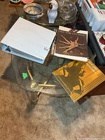 Binder, New York City Ballet program, gold program booklet on glass table