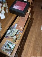 Drawer view showing Hoselton figure, brass elephants, display boxes and assorted items