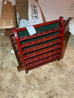 Front angled view showing red display shelf and partial brown shelf