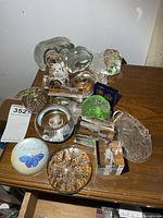 All glass paperweights displayed on table