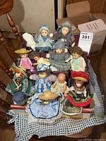 Front view showing dolls and stand