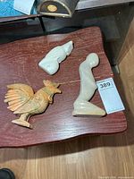 All three stone figures on table