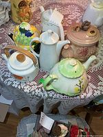 Group shot of five vessels on lace table