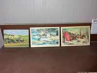 Front view of three postcards side by side