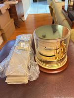 Front view of barograph showing brass mechanism and drum chart