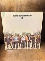 Front cover showing album title and band photo