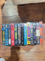 All 13 VHS tapes lined up showing spines