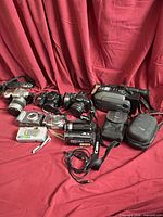 Group view of all cameras, camcorders, cases and cable