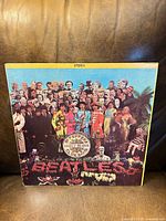 Front cover showing iconic collage artwork