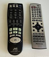 Two remote controls, JVC LP20337-006 and Panasonic EUR7651240A, front view showing button layouts and branding