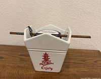 Front view of stoneware takeout box bowl with chopsticks