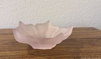 Side view showing frosted pink lotus bowl profile