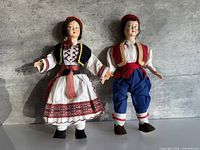Front view of both Croatian folk dolls