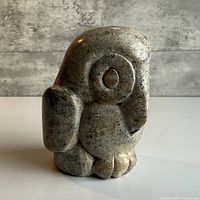 Front view of stone owl figurine