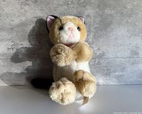Front view of tan and white Playtime Kitties plush cat
