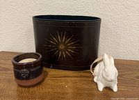 All three items: metal wastebasket, stoneware holder with tealight, ceramic rabbit