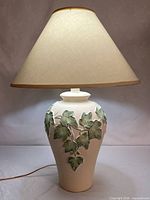 Full view of ceramic lamp with shade