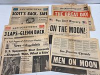 Six newspaper front pages spread out