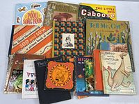 Group shot of all books laid out showing titles and quantity