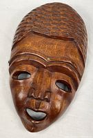 Full view of carved wooden mask