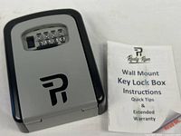 Front view of Rudy Run combination lock box beside instructions