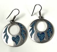 Front view of both earrings showing blue inlay heart and feather motifs