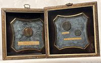 Both framed coin displays side by side