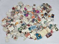 Pile of assorted postage stamps, varied colors and designs