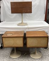 Front view of complete KLH Model Twenty system with amplifier/turntable unit and two speakers on tulip bases