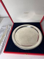 Tray inside Cartier box with cloth pouch visible