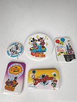 Group shot of all five Disney pinback buttons