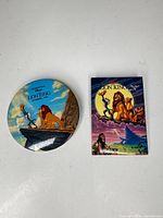 Front view showing both pin-back buttons and their graphics