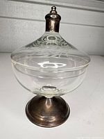 Full view of compote with lid showing glass bowl and silver base