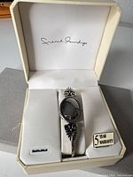 Watch in open branded box